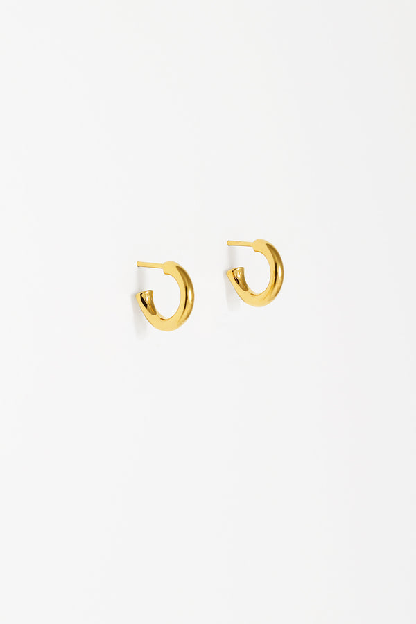 Also wearable as a plain small bold gold hoop with the pearl charm removed. 