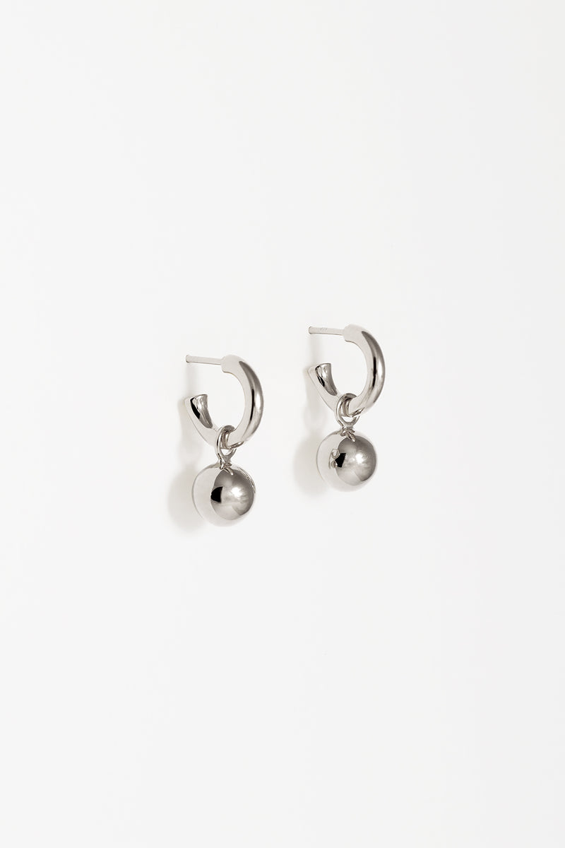 Small silver charm hoops with removable orb. 
