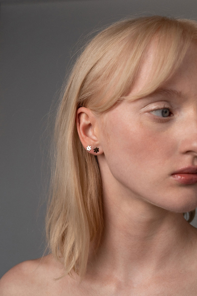 Two Flower Studs Worn in Golden Brass