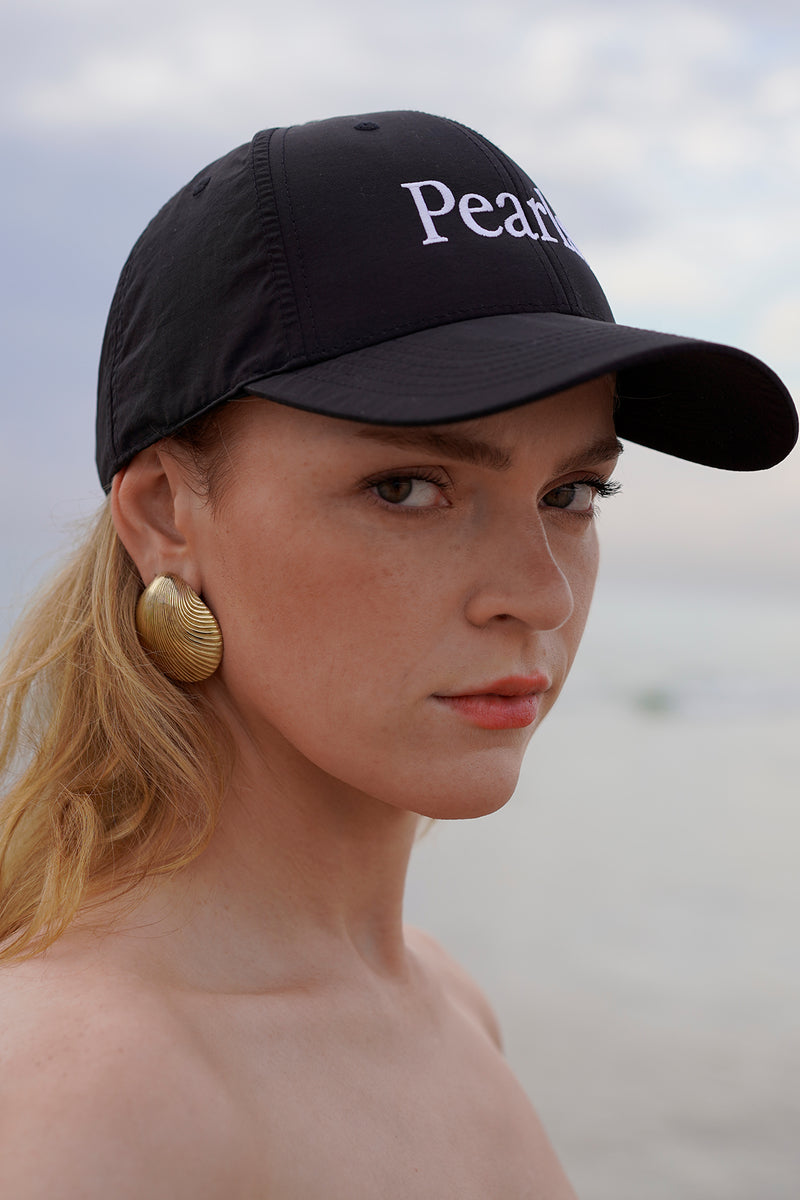 Pearls Cap Worn with Shell Earrings