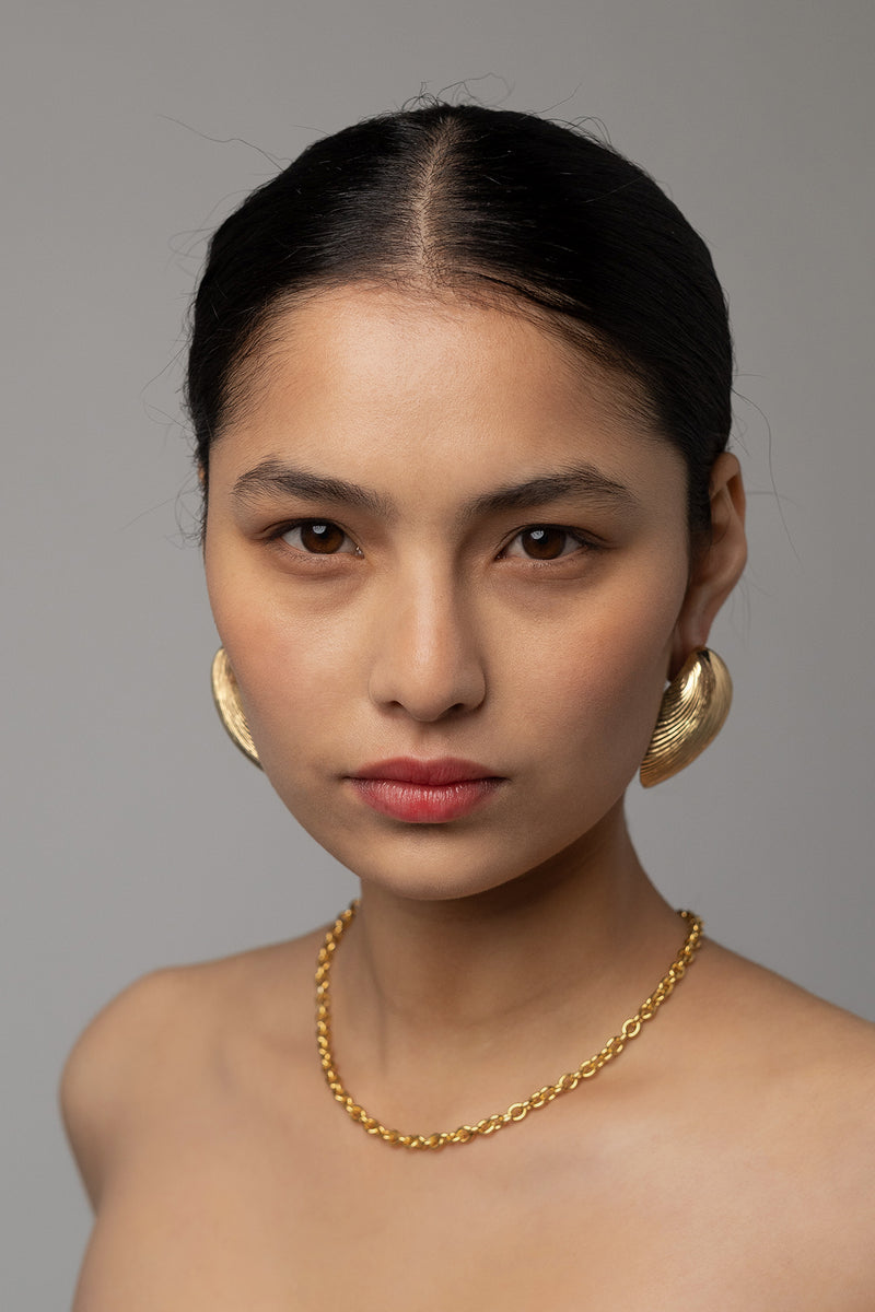 Jumbo Shell Earring in Golden Brass, Worn Front View