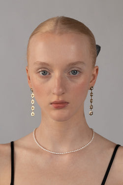 Wavy Daisy Earrings in Golden Brass, Worn Front View